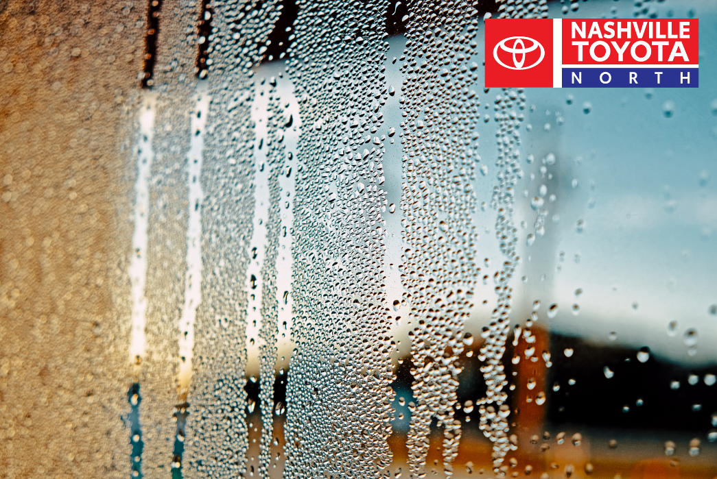 a close up of a window with water droplets on it