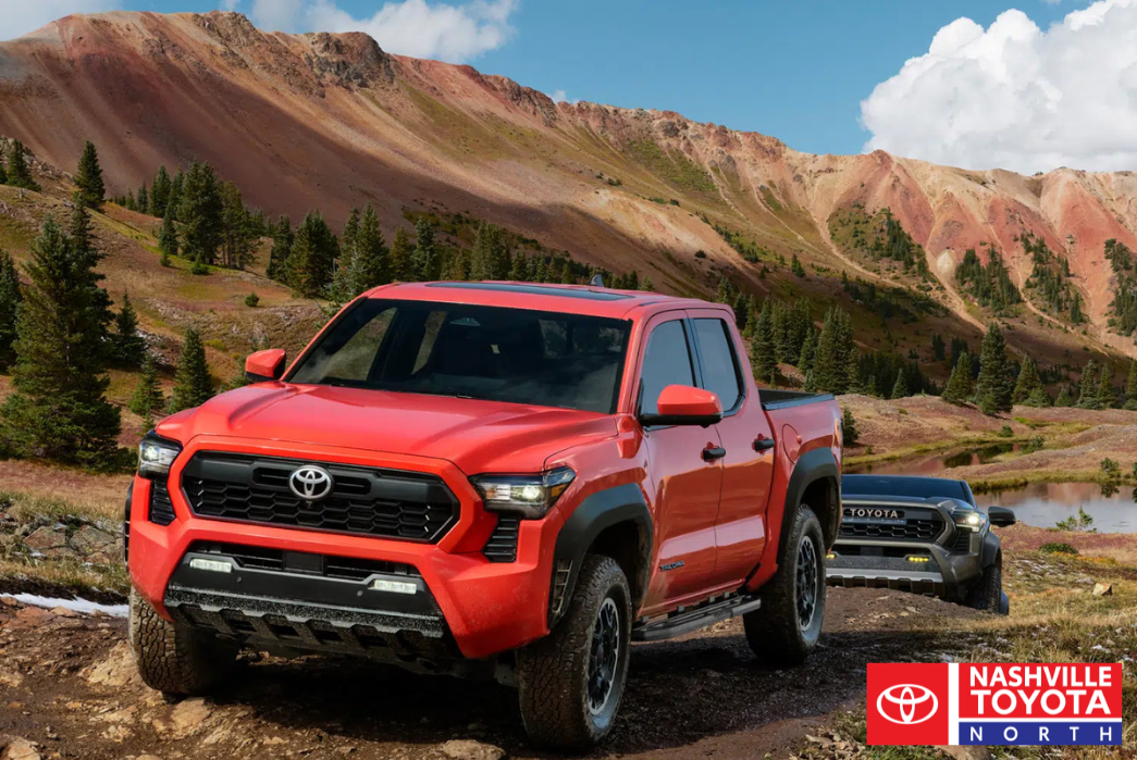 toyota tacoma is driving on a dirt road