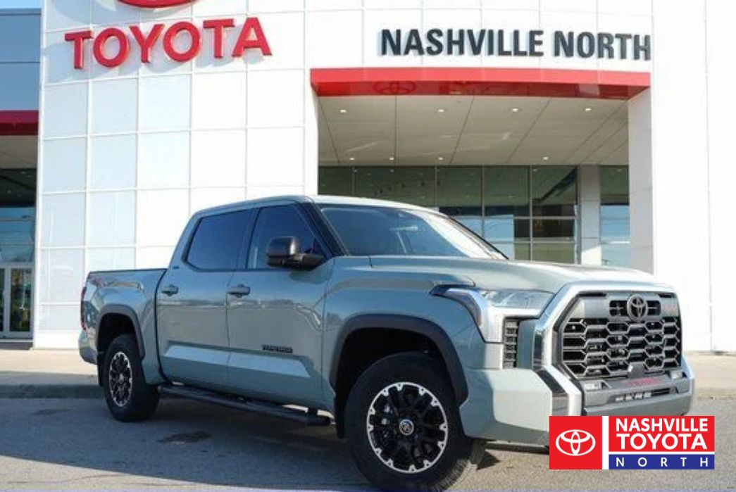 A light blue Toyota Tundra TRD Pro truck parked in front of a Toyota dealership with the "Nashville Toyota North" sign visible.