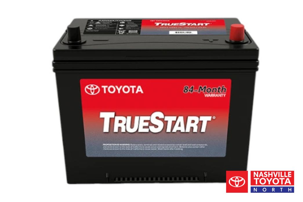 A black Toyota TrueStart car battery with an 84-month warranty displayed on a red label.